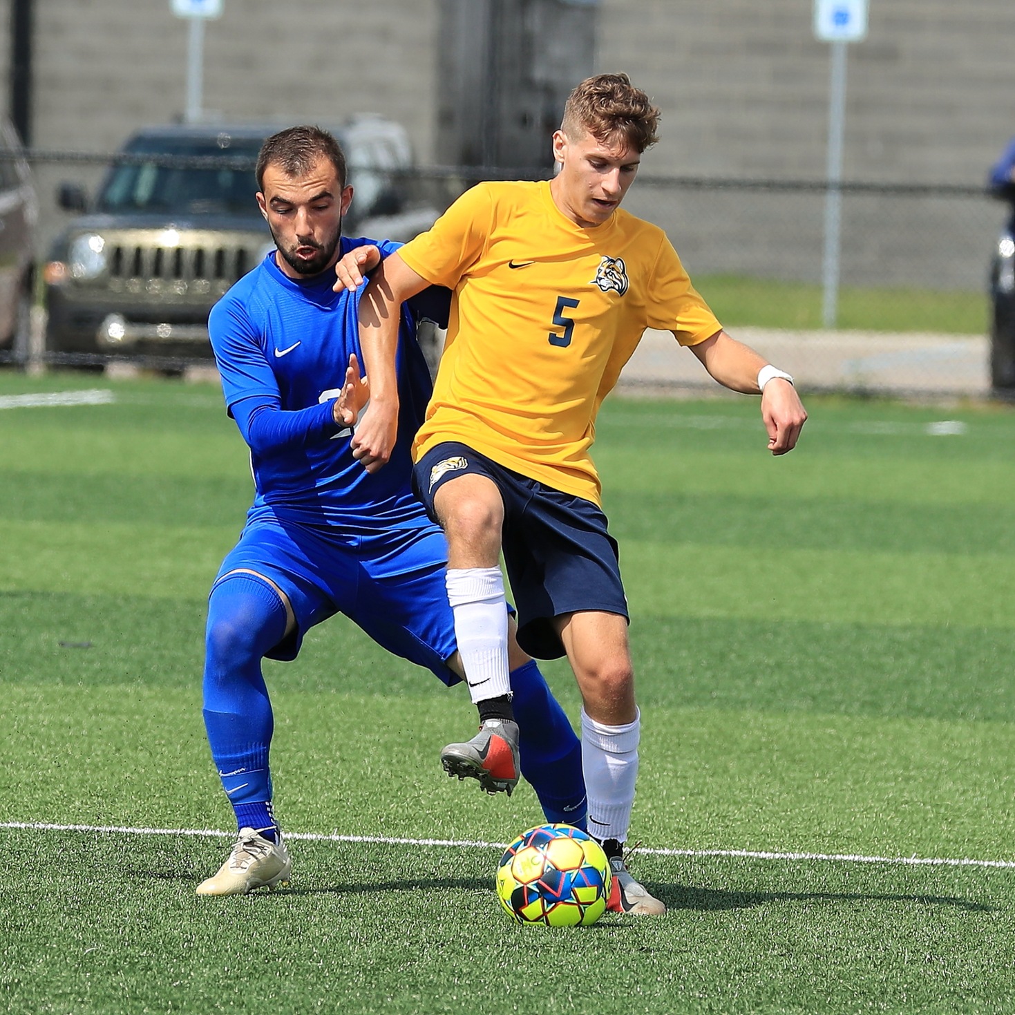 Muskegon CC and Schoolcraft College players battle for the ball