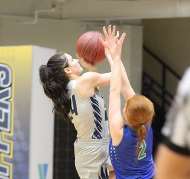Mid Michigan's Savannah Peplinski goes up for a shots against Bay College.
