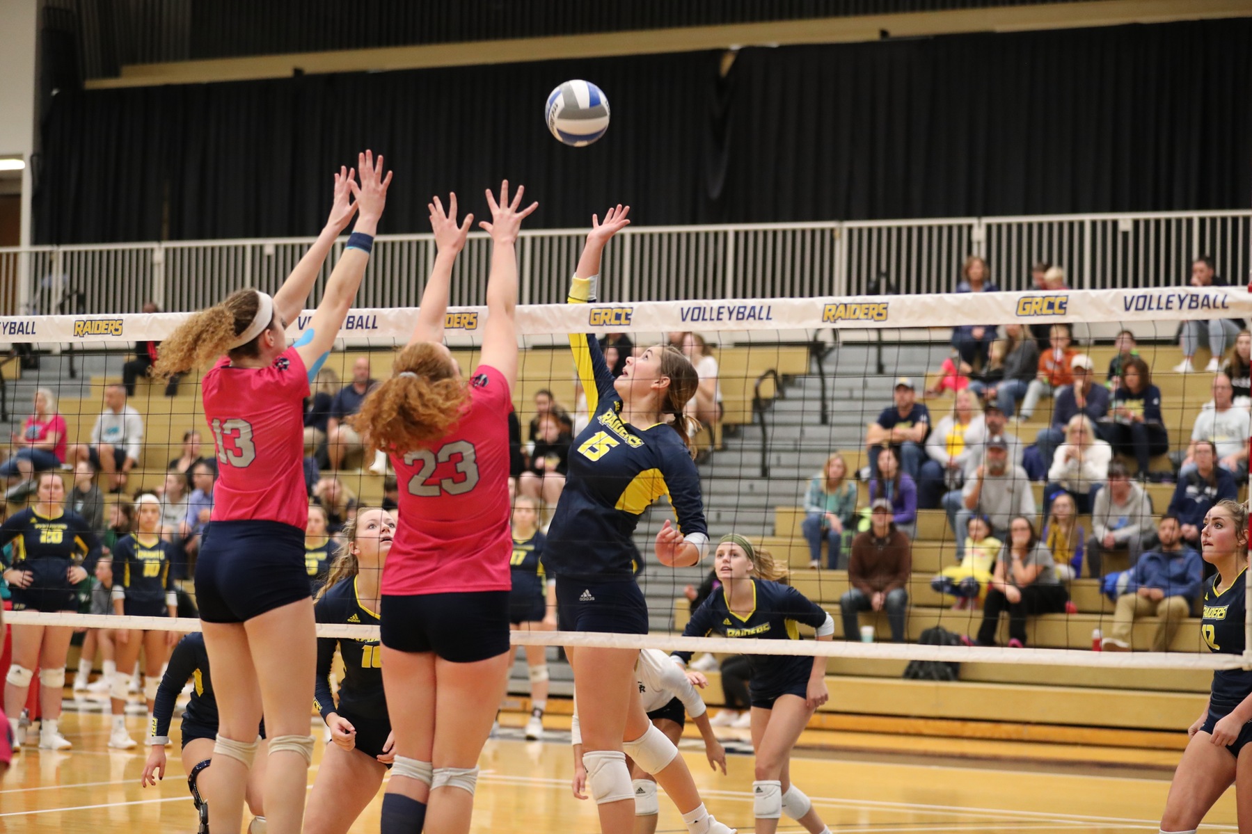 Grand Rapids CC volleyball players goes for an attack