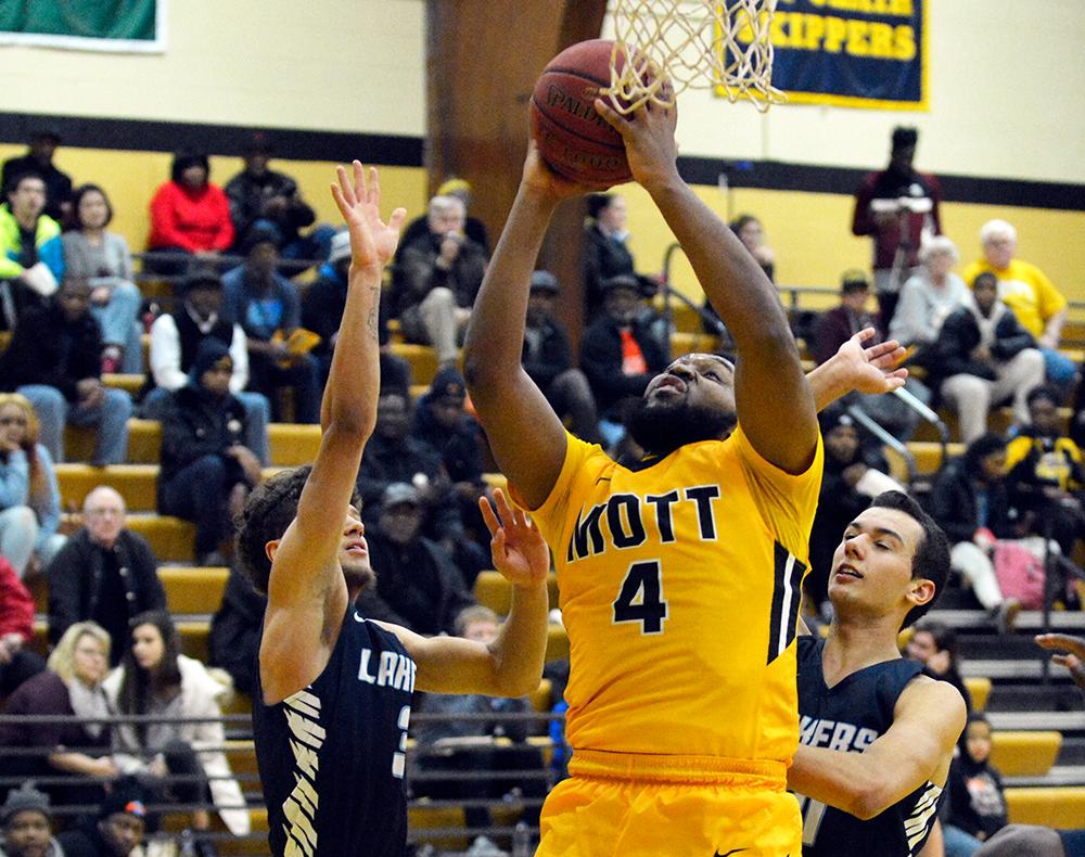 Mott's Henry Speight goes in for a layup