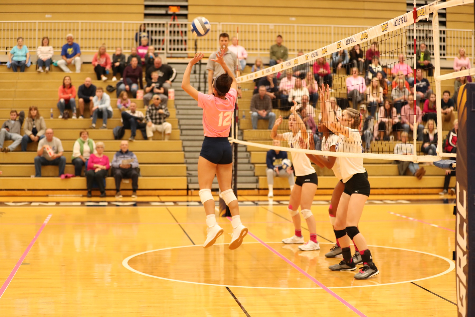 Grand Rapids setter sets the ball in a match against Kellogg CC